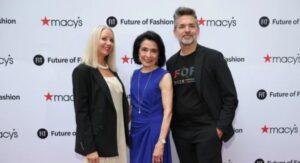 Jennifer Fashion Institute Tulsa Teacher guiding students in fashion design classroom.