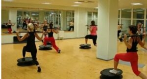 Member lifting weights in a well-equipped Delta Fitness Authority gym