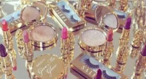 A selection of jewelry pieces paired with complementary makeup palettes, showing how colors and tones coordinate for a stylish look.