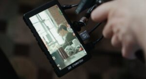 Laptop screen displaying buffering video while fixing video playback problems.