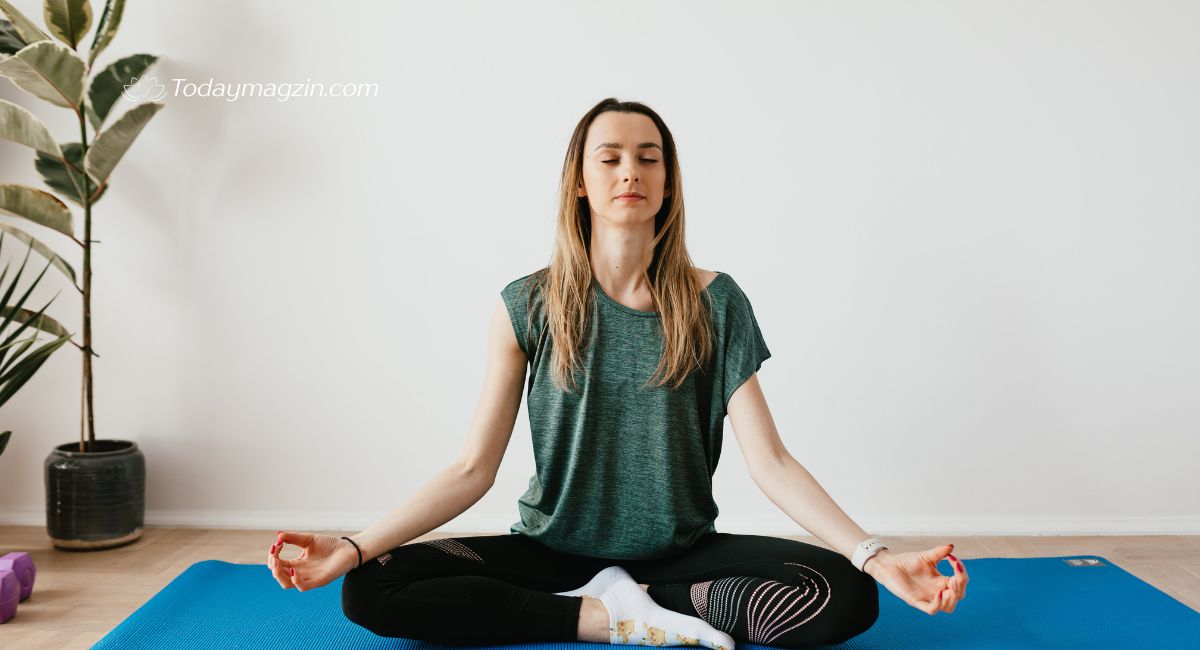 Woman practicing yoga outdoors with a calming motivational saying